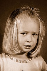a sepia portrait of a female child