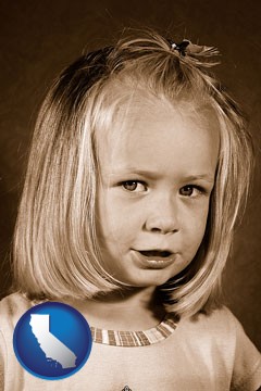 a sepia portrait of a female child - with California icon