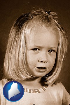 a sepia portrait of a female child - with Maine icon