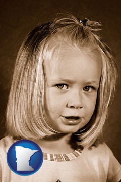 a sepia portrait of a female child - with Minnesota icon