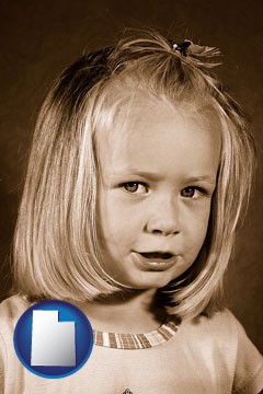 a sepia portrait of a female child - with Utah icon